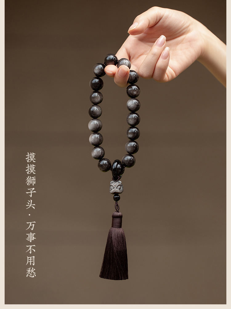 Muyun~Natural silver obsidian lion awakening holding rosary