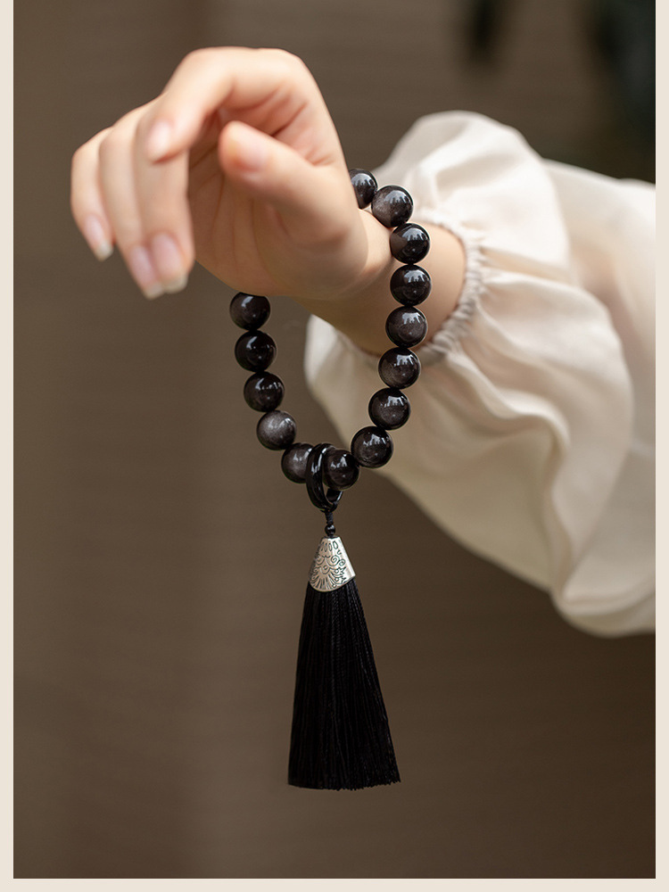 Muyun~Natural silver obsidian lion awakening holding rosary